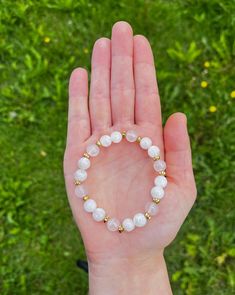 A simple but beautiful piece, this bracelet is made with 8mm Moonstone and Rose Quartz. Created for healing the heart space and creating a harmony of energy within the body. Complimented with brass spacers and strung onto elastic for comfort. Adjustable Rose Quartz Stretch Bracelet, Spiritual Style, Adjustable Rose Quartz Spiritual Stretch Bracelet, Hand-strung Spiritual Rose Quartz Stretch Bracelet, Spiritual Hand-strung Rose Quartz Stretch Bracelet, 8mm Rose Quartz Meditation Bracelets, Rose Quartz Beaded Bracelets For Meditation, Healing Moonstone Stretch Bracelet With Round Beads, White Rose Quartz Crystal Bracelet With Round Beads, Adjustable White Rose Quartz Beaded Bracelets