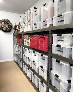 the shelves are filled with plastic containers and bins for storing items or other things