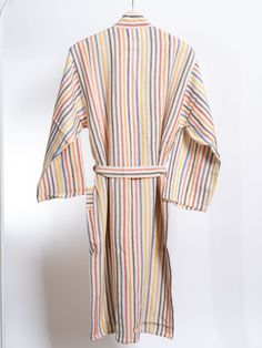 Brighten up your lounging experience with the Rainbow Robe, a vibrant and comfortable robe that wraps you in a burst of colors. Made from a soft cotton-linen blend, this robe features a lively striped pattern with hues of red, blue, yellow, beige, and charcoal, adding a cheerful touch to your everyday relaxation. Perfect for mornings at home, poolside lounging, or as a stylish cover-up after a bath. The Rainbow Robe is designed with a comfortable fit and is available in sizes, ensuring there’s a perfect fit for everyone. Handwoven on semi-automated looms, it showcases traditional craftsmanship with hand-finished details. The robe is lightweight, absorbent, and quick-drying, making it an ideal choice for year-round wear. Features: Soft cotton-linen blend for ultimate comfort Vibrant striped Striped Long Sleeve Robe For Loungewear, Multicolor Cotton Robe For Loungewear, Multicolor Summer Robe For Home Use, Multicolor Spring Loungewear Robe, Multicolor Spring Robe For Loungewear, Spring Multicolor Robe For Loungewear, Red Cotton Robe For Spring, Multicolor Summer Sleep Kimono, Multicolor Summer Robe For Loungewear