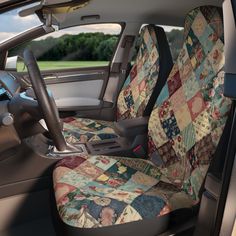 the interior of a car with patchwork quilt on it's seat covers and steering wheel