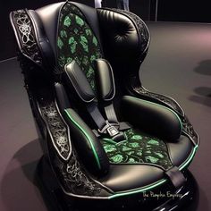 a car seat with green and black designs on it