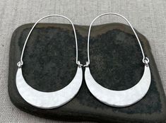 "These are very cool, simple and classic hammered hoop earrings.  They are subtle yet eye catching.  Dress them up or down.  The earrings are versatile and perfect for everyday wear. The earrings measure 2 1/4\" long by 1 1/2\" wide.  Made from plated silver. I have this same earring style also available in a golden coppery color way.  Here is a direct link www.etsy.com/listing/1223497563 Thanks for stopping by!  Please take a moment and visit the rest of my Etsy shop.  I have many more unique j Nickel-free Crescent Hoop Earrings For Everyday, Everyday Crescent Hoop Earrings Nickel Free, Everyday Crescent Hoop Earrings With Ear Wire, Tiger Flower, Modern Hoop Earrings, Mountain Earrings, Boho Hoop Earrings, Mountain Jewelry, Hammered Hoop Earrings