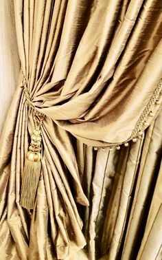 a curtain with tassels hanging from it