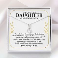 a necklace in a gift box that says to my beautiful daughter on your wedding day