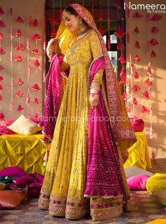 Yellow Bridal Dress in Traditional Pishwas Style is a stunning attire that steals everyone's hearts at the very first glance. This beautiful Mehndi Dress is hand-embellished with fine adornments and traditional designs to create a breathtaking Pakistani Bridal Dress for the wedding day. You can pair the Pishwas with Lehenga or churidar on customized orders. Pishwas: Traditional Pishwas in the alluring yellow shade has a premium quality Chiffon fabric. This stunning Pishwas Dress is beautifully e Mayoon Dresses, Nameera By Farooq, Pakistani Bridal Lehenga, Pakistani Mehndi, Pakistani Bridal Dress, Mehndi Dresses, Mehndi Dress, Lehenga Gown, Pakistani Party Wear