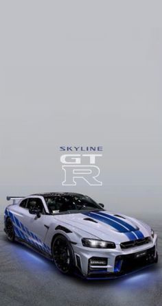 a white car with blue stripes on it's hood and the words skyline gtr