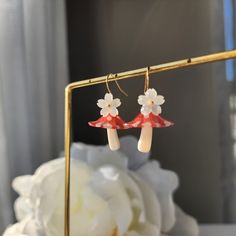 Our lovely mushroom umbrella earrings are made with resin mushroom and 14k gold plated earring hook which are good for delicate ears. Size: the length is about 1.5" Cute Dangle Earrings With Mushroom Design, Cute Mushroom Design Dangle Earrings, White Earrings With Mushroom Design As Gift, White Mushroom Design Earrings For Gift, White Mushroom Design Earrings As Gift, Cute White Earrings With Mushroom Design, Whimsical White Mushroom Design Earrings, Cute White Mushroom Design Earrings, White Dangle Earrings With Mushroom Design