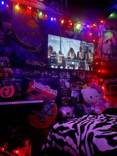 a bedroom decorated with neon lights and stuffed animals