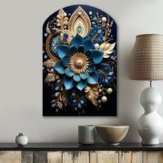 a blue and gold flower painting on a wall