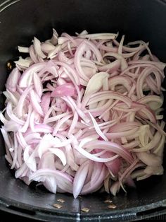 onions are being cooked in an air fryer