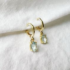 Eye catching 14k gold filled aquamarine huggie style hoops. Lightweight. Size: 1” 14k gold filled hoops Charms: 10mm Lead & nickel free / Hypoallergenic Handmade Includes 100% organic cotton jewelry pouch This item is made to order, packaged, and shipped with love from our studio located in West Chester, PA. *Click here to learn more about gold filled jewelry Handmade 14k Gold Filled Huggie Earrings For Gifts, Everyday Handmade 14k Gold Filled Huggie Earrings, Birthstone Huggie Earrings, Hoops Earrings Gold, Laguna Blue, Cotton Jewelry, Hoop Charms, West Chester, Gold Filled Hoops