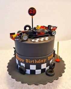 a birthday cake with a racing car on top