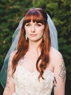 a woman with red hair wearing a wedding dress