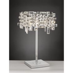 a crystal table lamp on a metal stand