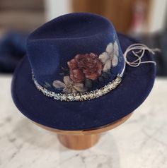 Felt/wool hat hand burned with floral pattern. Hand colored and hand made band. Adjustable and nice quality. beautiful navy blue color ... fun for any event, awesome Christmas gift! Handmade Blue Fedora With Flat Brim, Fedora Hat Bands For Kentucky Derby Gift, Unique Adjustable Blue Hat, Unique Blue Adjustable Hat, Unique Blue Festival Hats, Blue Handmade Hats For Kentucky Derby, Bohemian Winter Fedora For Party, Handmade Blue Fall Hats, Bohemian Winter Party Fedora