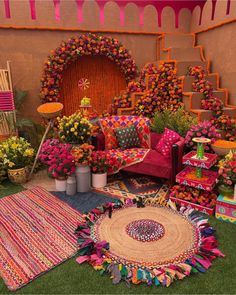 a room filled with lots of colorful furniture and flowers