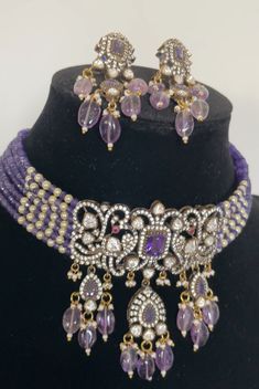 Peacock inspired Moissanite Necklace in purple beads with peacock pattern and earrings *Antique Finish *Premium Quality *Lab created Mossanite Necklace Type - Choker & has adjustable dori Earrings length 2 inches approximately and pushback. Festive Purple Jewelry With Stone Work, Festive Purple Stone Work Jewelry, Elegant Purple Jewelry Set For Festive Occasion, Party Chandbali Beaded Jewelry Sets, Purple Earrings For Festive Occasions, Purple Round Beads Jewelry For Festive Occasion, Elegant Purple Jewelry For Festivals, Elegant Purple Jewelry For Diwali, Purple Festive Earrings For Festivals