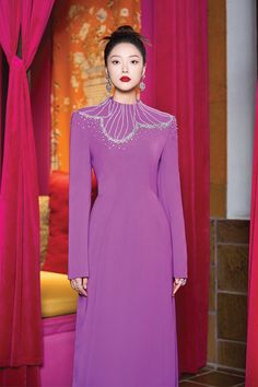 Elevate your wardrobe with the dress. Made with luxurious velvet and satin, this dress exudes elegance and sophistication. The high neck design adds a touch of refinement while the sheath silhouette flatters your figure. Perfect for a special occasion, this dress is a timeless addition to any wardrobe. * Note: The photo of the dress product is sketched based on the ao dai product and is for reference only. Dress products will not have slits on either side. Eid Suits, Corporate Woman, Suits Ideas, Corporate Women, Mean Blvd, Fashion Top Outfits, High Neck Designs, Floor Length Dress, Dresses Xxl