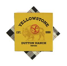 a yellow patch with black and white checkered border around it that says yellowstone on the front