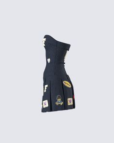 Bad b*tch vibes only 😜 Always be one step ahead of them in this navy pinstripe dress made from suiting fabric and complete with a fit & flare style, cute patches, and a pleated skirt 🖤 Strapless Ruffle Dress, Suiting Fabric, Cute Patches, Black Off Shoulder, Pinstripe Dress, Suit Fabric, White Jersey, Dark Fashion, Lookbook Outfits