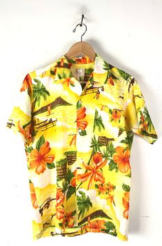 "-Description- >70s Sears men's bright floral island hawaiian shirt >button front >collared >open pocket on the front >very lightweight >size medium/large - not marked with a size so sizing is based off measurements - please check measurements before purchasing >gorgeous hawaiian shirt! >condition: great >color(s): yellow, orange, green, brown >brand: sears >care: hand wash -Measurements- >size: medium/large ✩ all measurements are taken with the item laying fl Hawaiian Shirt With Floral Print And Camp Collar, Spring Hawaiian Camp Shirt With Tropical Print, Printed Hawaiian Shirt For Beach Season, Multicolor Floral Print Camp Shirt For Beach Season, Printed Yellow Camp Shirt For Beach, Yellow Hawaiian Shirt For Summer Vacation, Printed Yellow Camp Shirt For The Beach, Yellow Printed Camp Shirt For Beach, Yellow Printed Camp Shirt For The Beach