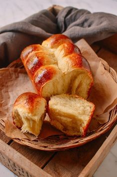 some bread is sitting in a basket on a table