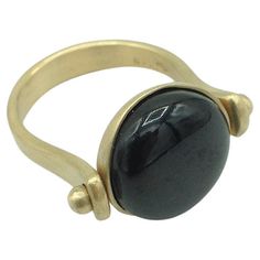 Roman Style Reversible Ring Black Jade Yellow 18 Karat Gold Made in Italy This ring is inspired by ancient Roman jewelry. They used to wear a ring where its head would be round. There's a black round jade as a button above and if you turn it around you'll have only gold where you can engrave a short phrase like a motto or initials as they used to do in the past. Perhaps even a message to celebrate a special occasion or anniversary. The size of the ring is 6 US - 12 EU. The measurements below ref Reversible Ring, Ancient Roman Jewelry, Roman Jewelry, Rome Antique, Black Jade, Roman Style, Yellow Rings, Roman Fashion, Jade Ring