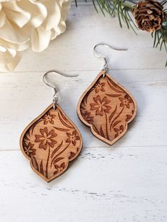 "Introducing our Nature Engraved Wood Earrings, a stunning addition to any jewelry collection. These double layer earrings are crafted from high-quality wood, ensuring durability and longevity. The intricate nature-inspired engravings add a touch of elegance and sophistication to any outfit. With their lightweight design and comfortable fit, these earrings are perfect for everyday wear. Treat yourself or someone special to these beautiful and unique earrings today. Product detail: Height: 1.75\" Wooden Teardrop Earrings As Gift, Wooden Teardrop Earrings For Gift, Teardrop Wooden Earrings For Gifts, Teardrop Wood Earrings For Gifts, Teardrop Wood Jewelry Gift, Wooden Earrings For Gift, Natural Wood Drop Earrings For Pierced Ears, Natural Wood Jewelry Gift, Wooden Jewelry With Matching Earrings As Gift