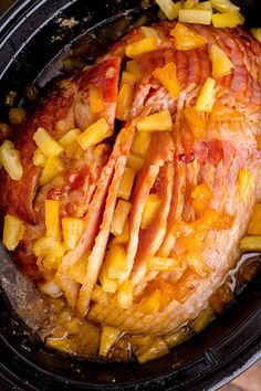 ham and pineapples are cooked in the slow cooker