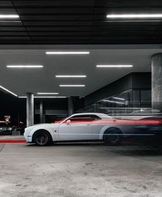 a white car parked in a parking garage