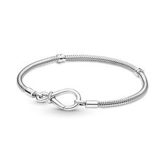 PRICES MAY VARY. Infinity Knot Snake Chain Bracelet: Inspired by the bond between a mother and child, the PANDORA Moments Infinity Knot Snake Chain Bracelet features an asymmetrical infinity knot that serves as the clasp Compatible with Pandora Moments: Pandora Moments is a way to say something about who you are through every charm and bracelet you choose and how you choose to wear it Versatility: This PANDORA bracelet can be adorned with or without charms, making it versatile for all style pref Charms Pandora, Infinity Knot, Bracelet Pandora, Snake Chain Bracelets, Sterling Silver Charm Bracelet, Knot Bracelet, Jacob Black, Silver Charm Bracelet, Pandora Bracelets