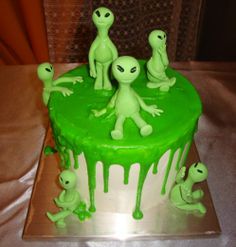 an alien themed cake with green icing