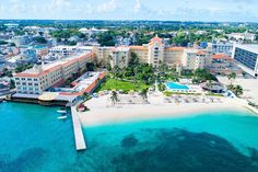 an aerial view of the resort and beach