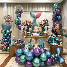 an image of a birthday party with balloons and mermaids on the table for sale