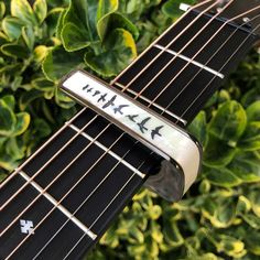 a close up of the frets on an electric guitar with birds and stars painted on it