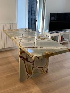 a table that has some kind of design on it in the middle of a room