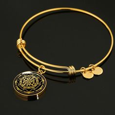 "This Sri Yantra Bracelet Is the Perfect Gift Whether for Yourself or a Loved One. Explore all our sacred geometry jewelry here: https://www.etsy.com/in-en/shop/SymbolicPresent?ref=simple-shop-header-name&listing_id=877238359§ion_id=22613481 ➜ Our jewelry is made of high-quality surgical steel with a shatterproof liquid glass coating and an 18k gold finish option. ➜ Engrave onto the back of the Sri Yantra pendant your loved one's name, your wedding date, an anniversary, or anything else you Spiritual Nickel-free Bangle Jewelry, Nickel Free Spiritual Bangle Jewelry, Spiritual Bangle Jewelry Gift, Spiritual Round Metal Bracelets, Symbolic Meditation Bracelet Jewelry, Witchcraft Jewelry, Sacred Geometry Jewelry, Stone Tattoo, Geometry Jewelry