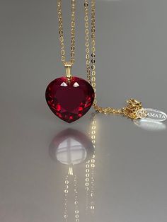 Gorgeous sparkly red topaz heart pendant necklace. The Faceted heart shape pendant is flawless and has the most vivid wine red color that brings lots of depth to the stone and reflects lights beautifully. The pendant is strung on a 14K goldfilled chain. It is perfect for layering or looks great when worn alone. *Excellent quality AAA+ Flawless ruby Heart Shape Pendant *Pendant measure: 22mmx22 mm /0.9x 0.9 inch  *Metal: 14K gold-filled *necklace length: 55 cm /22 inch Solid gold, 14K gold-filled Ruby Heart Necklace, Ruby Heart Pendant, Red Heart Pendant, Red Topaz, Necklace Ruby, Pendant Minimalist, Ruby Heart, Wine Red Color, Valentine's Gifts