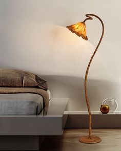 a lamp that is on the side of a bed