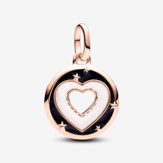 Radiate love with the Pandora ME Hearts Medallion Charm in 14k rose gold plating. This modern amulet features a cut-out heart at the centre, surrounded by a heart-shaped bioresin man-made mother of pearl frame. Around the heart is glittery black enamel sprinkled with raised stars, and the reverse side is detailed with radiating microbeaded lines. This medallion charm can be styled on Pandora Moments charm holders and openable links on Pandora ME carriers. - Pandora ME Hearts Medallion Charm - En Charms Pandora, Charm Holder, Pandora Bracelet Charms, Mesh Bracelet, Pandora Bracelets, Dangle Charms, Black Enamel, Bracelets And Charms, Pearl White