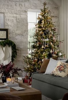 a living room with a christmas tree in the corner