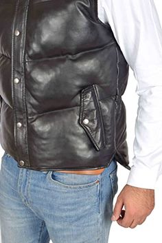 Men's Leather Puffer Vest In Black This men's leather puffer vest is a perfect combination of style and comfort. It has an outer shell made of real leather, while the inner visco-sheepskin layer provides ultimate warmth and durability. This vest features two side pockets with snap buttons, one inside pocket and its collar is turtle neck with zipper closure. Outer Shell: Real Leather Leather Type: Sheepskin Leather Finish: Semi-aniline Inner Shell: Viscose Lining Closure Style: Zipper With Snap B Leather Puffer Vest, Leather Shorts Women, Short Leather Skirts, Leather Puffer, Leather Jumpsuit, Studded Jacket, Distressed Jacket, Sheepskin Jacket, Western Jacket