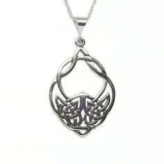 This Celtic Wolf necklace is designed in solid Sterling Silver and comes on your choice of a 16" or 18"  sterling chain. The pendant measures 43mm or 1.75".~The Celtic Wolf is a tribal design. "If you look at the design head on, you will see the face of a wolf created with Celtic Infinity knots. If you split the design down the middle with your eyes, you will also notice two wolves baying up at each other in the lower center of the design."©~The wolf symbolizes loyalty and protection.All pendant Viking Style Sterling Silver Round Pendant Jewelry, Viking Style Wolf Design Jewelry Gift, Viking Style Sterling Silver Necklace Gift, Viking Style Sterling Silver Nickel-free Necklace, Nickel-free Viking Style Sterling Silver Necklace, Nickel-free Sterling Silver Viking Necklace, Silver Wolf Design Symbolic Jewelry, Silver Symbolic Wolf Design Jewelry, Symbolic Silver Wolf Design Jewelry