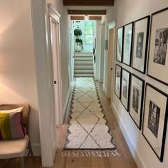 the hallway is clean and ready for guests to use it as an entrance way in this home