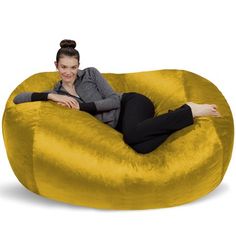 a woman sitting on a bean bag chair