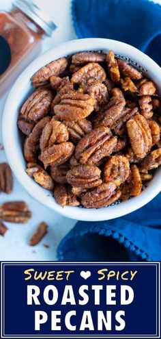 sweet spicy roasted pecans in a white bowl on a blue napkin with text overlay