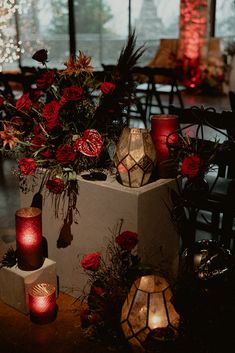 candles and flowers are on display in a room