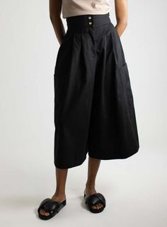 This style features:    - high waist cinched-in fit  - double front buttons  - zip fly  - side pockets  - two deep lower pockets  - front pleating  - wide legs and a slightly cropped hem length depending on height  - fabric content: 100% cotton    - machine wash cold  - hang dry    style tip: the goes-with-everything pants. made of heavyweight cotton these pants are durable comfortable and go with just about everything. dress them up with the matching blazer or keep it casual with your favorite Relaxed Fit Bottoms With Pleated Waist For Daywear, Workwear Bottoms With Pleated Waist And Short Length, Relaxed Fit High Waist Bottoms With Pleated Waist, High Waist Bottoms With Pleated Waist And Relaxed Fit, Black Utility Bottoms With Welt Pockets, Black Bottoms With Pleated Waist, Workwear Culottes With Elastic Waistband And Cropped Leg, Workwear Culottes With Elastic Waistband, Relaxed Fit Bottoms With Pleated Waist And Wide Leg