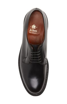 This plain-toe derby made from smooth leather has been hand stained and polished to a classic patina, a hallmark of Alden of New England. Lace-up style Cushioned footbed with arch support Water-resistant Leather upper, lining and sole Made in the USA Men's Shoes Vintage Preppy, Ivy League, Up Styles, Arch Support, Smooth Leather, New England, Derby, Hallmark, Dress Shoes Men