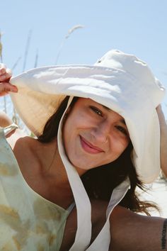 * Sun bonnets made from organic cotton twill are doubled for durability and long lasting sun protection. Keep the brim down for a dramatic look, or turn the brim up for a softer shape. A great addition to any outfit no matter what season! * Manufactured in small batches by women and queer owned factory Made X Hudson in Hudson, NY. * Sizing information: SM: 22" MD: 23" LG: 24" * Hat will be shipped rolled up for easy travel and packing! The beauty of this hat is that it won’t lose its shape. * Pl Cotton Curved Brim Bonnet For Beach, Curved Brim Cotton Bonnet For The Beach, Curved Brim Cotton Bonnet For Beach, Adjustable Cotton Summer Bonnet, Adjustable Cotton Bonnet For The Beach, Cotton Sun Hat With Uv Protection And Curved Brim, Solid Cotton Sun Hat With Flat Brim, Solid Color Cotton Sun Hat With Flat Brim, Cotton Brimmed Hat With Uv Protection